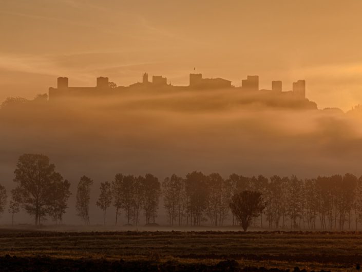 Alba sul castello di Monteriggioni